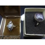 2 silver rings with decorative stones
