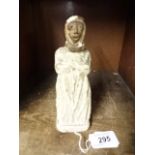 An early carved limestone statue, 6" tall of a nun? with browned face