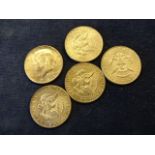 Five silver 1964 1/2 dollar coins