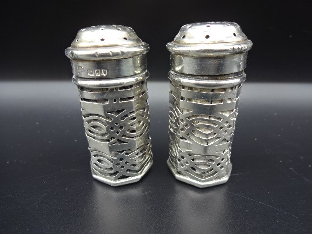 Pair of silver cruet pots complete with glass inserts, London 1898