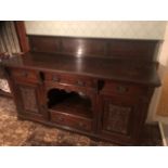 Victorian oak sideboard with carved design to doors and cellarette drawer inside