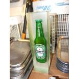 Bottle of Heineken set in resin