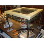 Square glass inset coffee table on metal legs