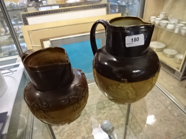 Royal Doulton (2892) and Doulton Lambeth jugs, both A/F