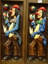 Pair of carved wooden clown wall hangings (70 x 25)cm