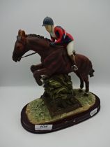 Resin horse and jockey figure, 24cm tall