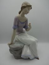 Lladro Nao girl, seated, 27cm tall