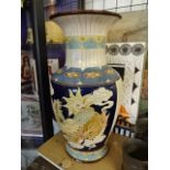 Large oriental vase depicting dragons, stamped 138. 53cm tall