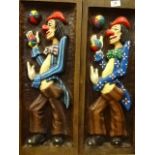 Pair of carved wooden clown wall hangings (70 x 25)cm