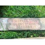 Vintage Cast Iron Dealer / Suppliers Badge . The sign is approx 10 x 3 inches