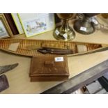 Treen to include storage box, vintage rule and nutcrackers plus canoe model, 65cm long