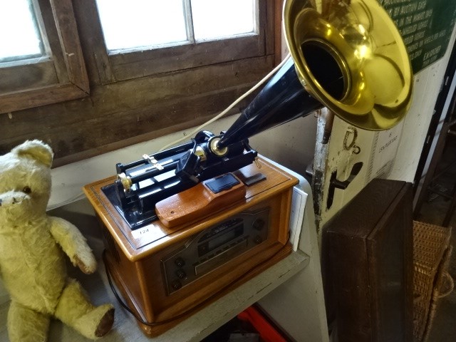 Modern radio and CD player in the form of a vintage gramophone, with remote and instructions