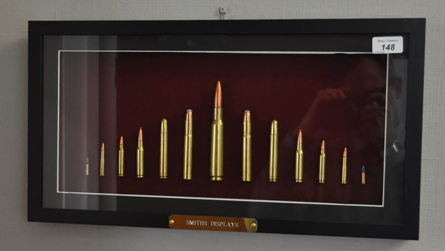 Framed and mounted collection of inert sporting rifle cartridges made by P. Smith 29cm x 54cm