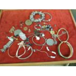 Box of assorted gold and silver coloured jewellery
