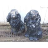 PAIR OF CONCRETE SPANIEL GARDEN ORNAMENTS PAINTED BLACK 40 INCHES TALL