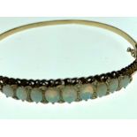 A 9ct gold(.375) 9 opal braclet with safety chain