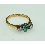 An 18ct three stone ring aquarmarine & diamonds (18ct .750 stamp)