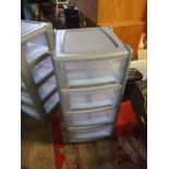 2 Plastic 4 Drawer Units 15 inches wide 33 tall . (can be stacked on top to make tall 8 draw. )