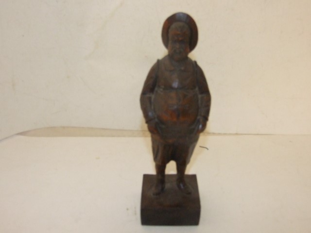WOODEN FIGURE OF A PORTLY SPANISH MAN