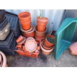 Large quantity of Plastic pots , planters and seed trays ( buyer must clear contents of pots as well