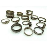 Thirteen silver rings of various sizes