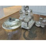 2 SILVER PLATE CRUET SETS AND A HUNTLEY AND PALMER BISCUIT BARREL A/F Cracked Glass