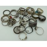 A quantity of mixed costume and silver rings of various sizes