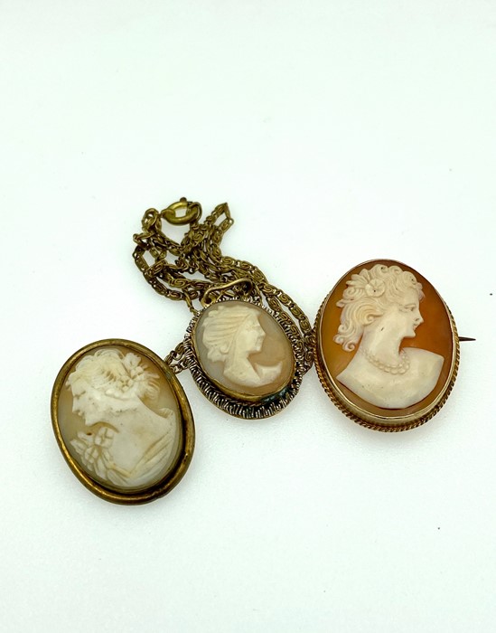 Two gold mounted oval Cameo brooches with a gold mounted cameo pendant