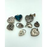 Nine silver heart shaped lockets