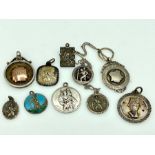 A collection of St Christopher pendants and other pendant medals