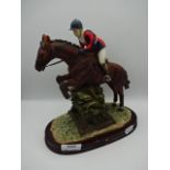 Resin horse and jockey figure, 24cm tall
