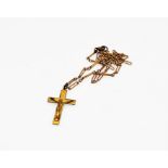 A rolled gold crucifix necklace with chain