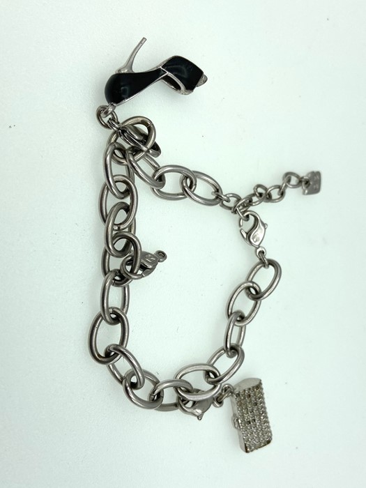 A charm bracelet with stiletto shoe and hangbag
