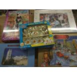 4 UNOPENED JIGSAW PUZZLES AND A CHILDS TEA SET