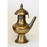 Ceremonial brass Tibetan water jug with screw on lid, 23cm tall