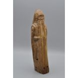 A Chinese hardwood carving of Shoulao, 29cm tall base has been drilled hollow, a primitive style