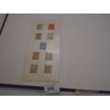 COLLECTION OF BRITISH STAMPS IN A BROWN ALBUM