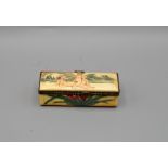 A DECORATED JAPANESE BONE LIDDED BOX WITH EROTIC SCENE