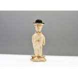 A vintage pipe clay cake decoration topper of Charlie Chaplin