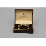 A boxed H Samuel set of cufflinks, tie pins, a gold plated tie slide clip and a GUY of London