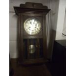 Oak Cased Wall Clock with key & pendulum 14 x 27 inches