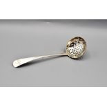 Silver sugar sifting ladle London 1799 makers mark worn with a crest, 29 grams