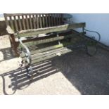 Garden Bench with Wrought Iron Ends 70 inches wide ( wood needs attention )