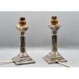 A pair of silver candlestick lamps hallmarked Williams (Birmingham) Ltd 1911