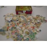 TIN OF ASSORTED STAMPS