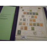COLLECTION OF HAITIAN STAMPS IN A BLACK FOLDER
