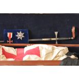 A Masonic Knights Templar case 40" long containing a sword, scabband with frog, mantle, sash cap