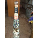 Vintage Metaxa Bottle on Metal Stand full of Marbles