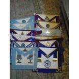 16 various Masonic aprons and 7 collars.