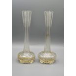 A pair of glass bud vases 25cm tall and a fine bone china cup and 2 saucers